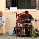 A privately licensed shoe repairman (R) works along a street in Havana February 2, 2012. Unseen in the past, private entrepreneurs are an example of how life is changing in Cuba since President Raul Castro launched a string of limited economic reforms, legalizing certain kinds of businesses, including restaurants, hostels and street vendors. Picture taken February 2, 2012. To match Special Report CUBA-ECONOMY/REFORMS